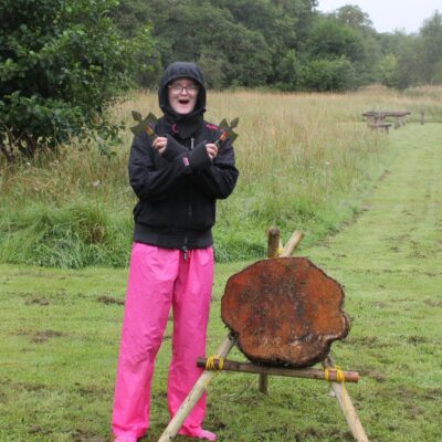 Girl Guide Bethany Johnson poses with with tomahawk equipment