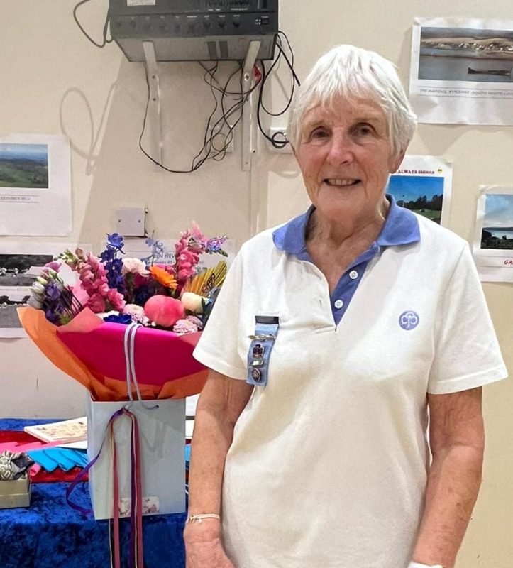 Elspeth Mitchell with a bouquet of flowers