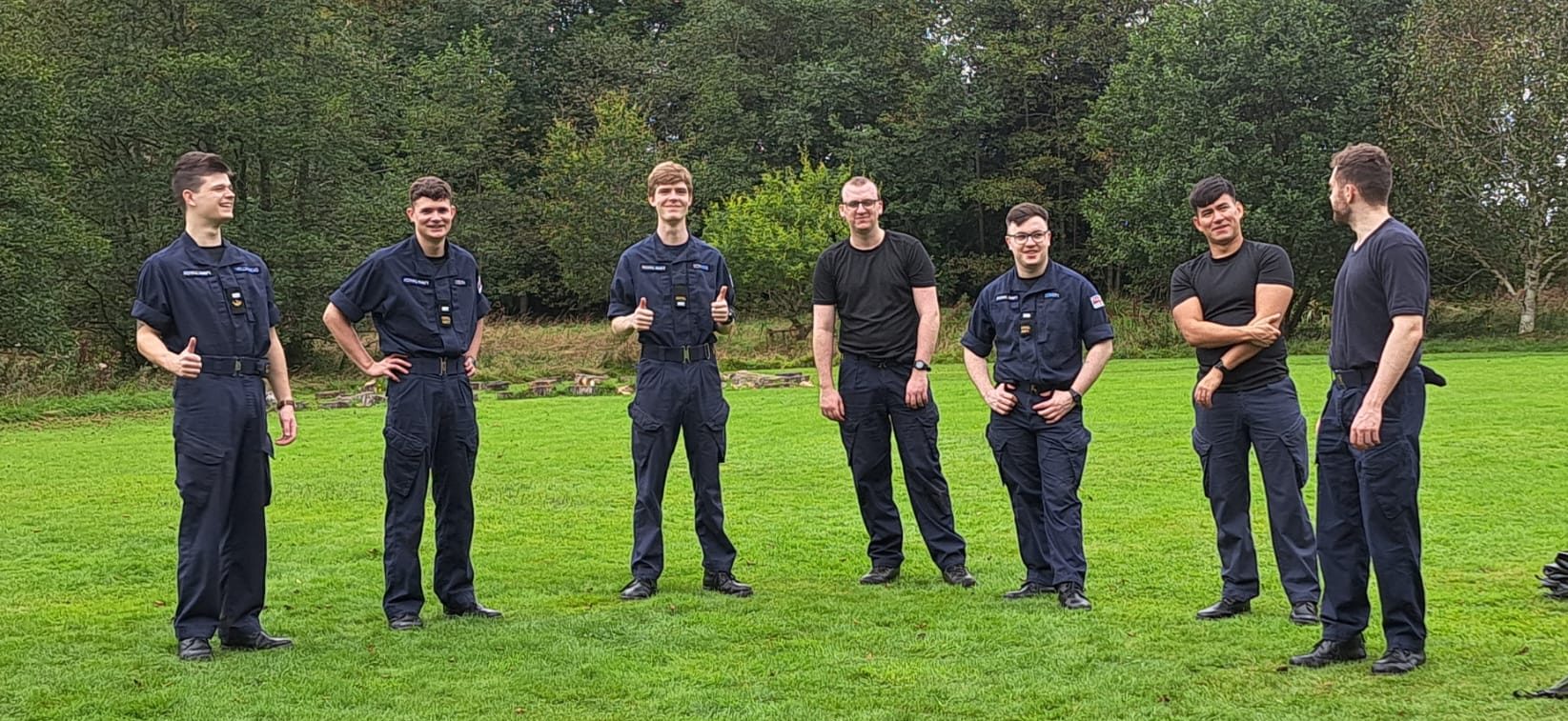 6 members of the Navy standing facing the camera at Catterburn campsite